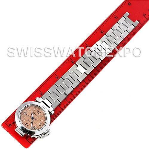 The Cartier Pasha W31075M7 Men
s Stainless Steel Pink Dial W31075M7 Men
s Stainless Steel Pink Dial watch is shown from a top-down angle, placed next to a red ruler for size reference.