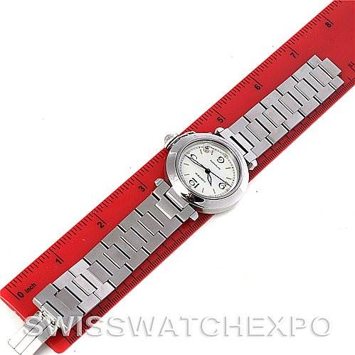 The Cartier Pasha W31043M7 Men's Stainless Steel Silver Dial W31043M7 Men's Stainless Steel Silver Dial watch is shown from a top-down angle, placed alongside a red ruler for size comparison.