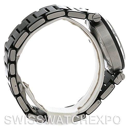 The image shows the side view of a Cartier Pasha W31077U2 Men's Stainless Steel Black Dial W31077U2 Men's Stainless Steel Black Dial watch, highlighting the bezel, crown guards, and bracelet links.