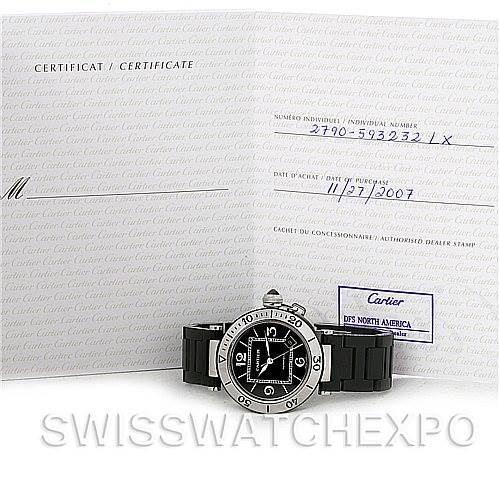 The image shows a Cartier Pasha W31077U2 Men's Stainless Steel Black Dial W31077U2 Men's Stainless Steel Black Dial watch and its certificate, photographed from the front.