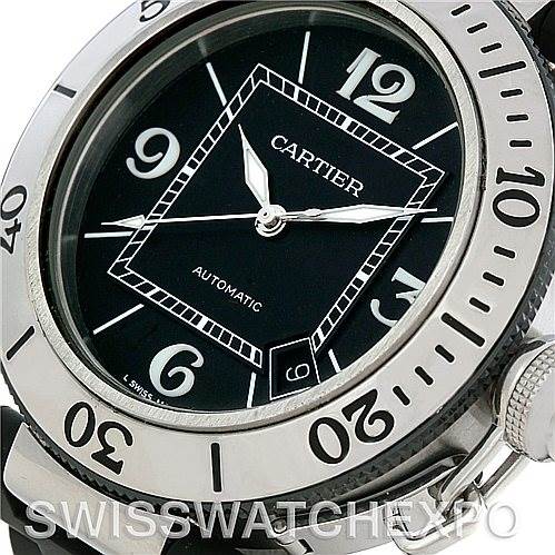The image shows a close-up angle of a Cartier Pasha W31077U2 Men
s Stainless Steel Black Dial W31077U2 Men
s Stainless Steel Black Dial watch, highlighting its round dial, numerals, and bezel markings.