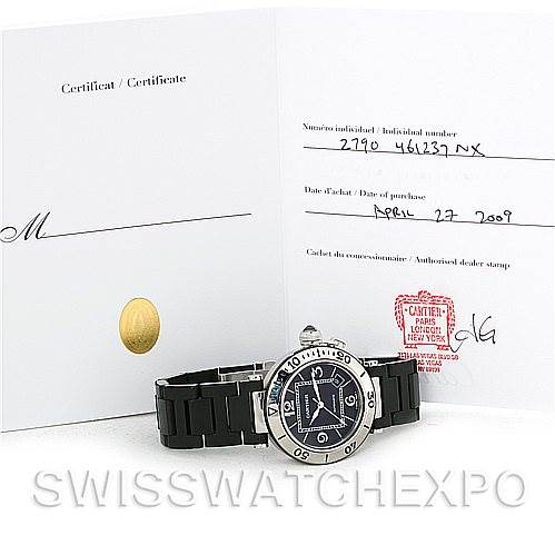 The image shows a Cartier Pasha W31077U2 Men
s Stainless Steel Black Dial W31077U2 Men
s Stainless Steel Black Dial watch at a slight angle with its certification documents displayed behind it.