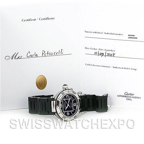 The image shows a Cartier Pasha W31077U2 Men's Stainless Steel Black Dial W31077U2 Men's Stainless Steel Black Dial watch from a front angle along with its certificate of authenticity.