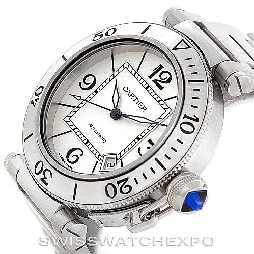 The image shows a Cartier Pasha W31080M7 Men
s Stainless Steel Silver Dial W31080M7 Men
s Stainless Steel Silver Dial watch angled to display its face, bezel, and part of the band with a sapphire-accented crown.