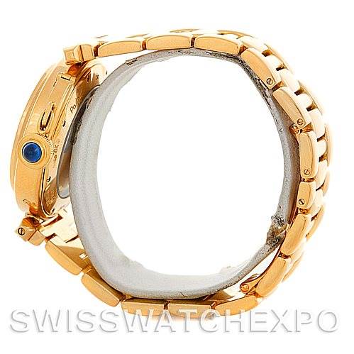 The image shows a side view of the Cartier Pasha MG222080 Men's Yellow Gold Silver Dial MG222080 Men's Yellow Gold Silver Dial watch, highlighting its gold bracelet and crown with a blue cabochon.