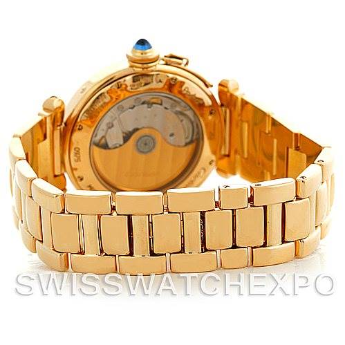 The image shows the back view of a Cartier Pasha MG222080 Men's Yellow Gold Silver Dial MG222080 Men's Yellow Gold Silver Dial watch, highlighting its gold bracelet and the transparent case back.