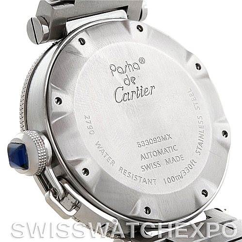 This image shows the back case of a Cartier Pasha W31080M7 Men
s Stainless Steel Silver Dial W31080M7 Men
s Stainless Steel Silver Dial watch, highlighting its inscriptions and the crown with a blue gem.