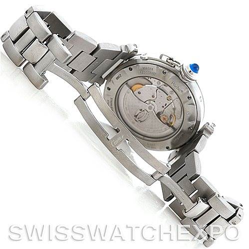 The image shows the back view of a Cartier Pasha W31037H3 Men
s Stainless Steel Silver Dial W31037H3 Men
s Stainless Steel Silver Dial watch, highlighting the watch
s intricate inner mechanisms and a part of the metal bracelet.