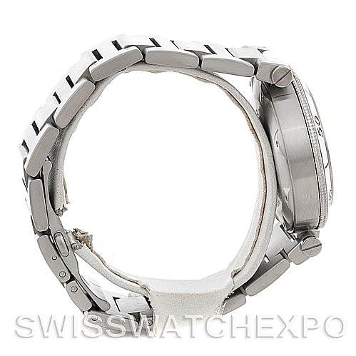 This image shows a side view of the Pasha model watch by Cartier, featuring its metallic bracelet and case.