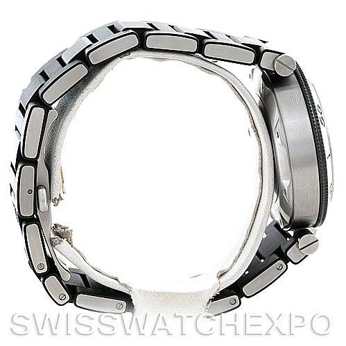 The image shows a side profile of the Cartier Pasha W31077U2 Men's Stainless Steel Black Dial W31077U2 Men's Stainless Steel Black Dial watch, highlighting its bracelet, crown, and case.