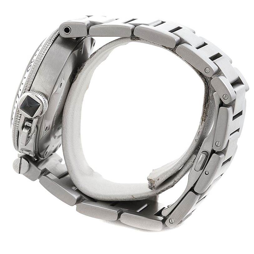 This image shows a side view of a Cartier Pasha W31077M7 Men's Stainless Steel Black Dial W31077M7 Men's Stainless Steel Black Dial watch, focusing on the bezel, crown, and metal bracelet.