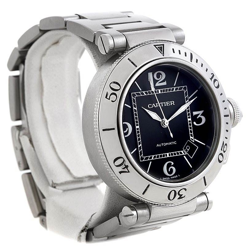 The image shows a Cartier Pasha W31077M7 Men's Stainless Steel Black Dial W31077M7 Men's Stainless Steel Black Dial watch at an angle displaying its face, bezel with numerical markers, and part of the metal bracelet.