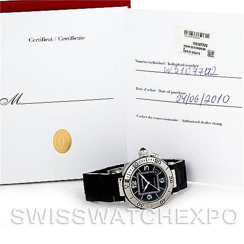 The image shows a Cartier Pasha W31077U2 Men
s Stainless Steel Black Dial W31077U2 Men
s Stainless Steel Black Dial watch with a black strap and its certification papers from a slightly elevated front angle.