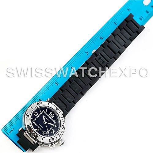 The Cartier Pasha W31077U2 Men
s Stainless Steel Black Dial W31077U2 Men
s Stainless Steel Black Dial watch is shown from a top-down angle, alongside a ruler for scale, displaying its dial, bezel, and band.