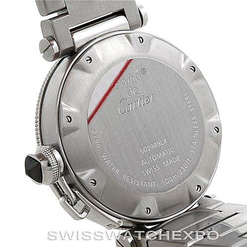 The image shows the back case of the Cartier Pasha W31077M7 Men's Stainless Steel Black Dial W31077M7 Men's Stainless Steel Black Dial watch, highlighting details including the inscription and part of the metal bracelet.