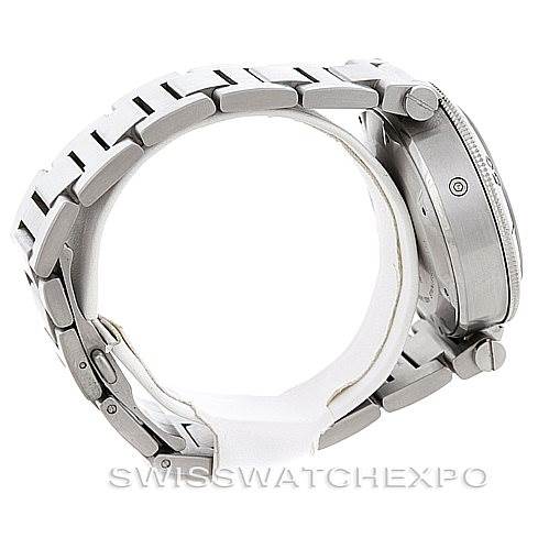 This image shows the side view of a Pasha model by Cartier, highlighting the watch's bracelet, crown, and case.