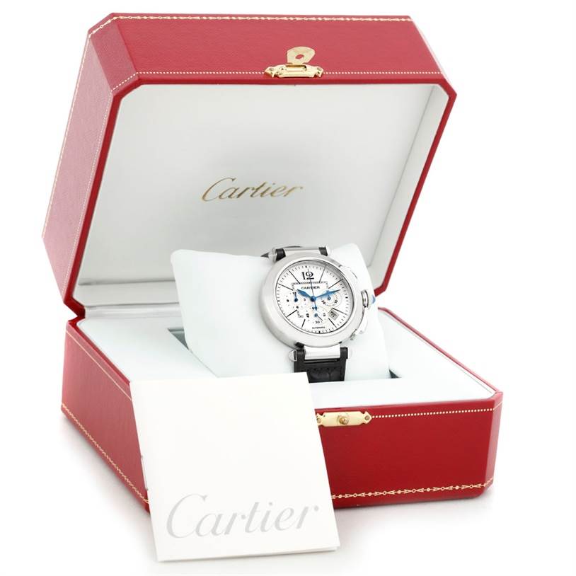 The Cartier Pasha W3103055 Men
s Stainless Steel Silver Dial W3103055 Men
s Stainless Steel Silver Dial watch is shown in its red case from a front angle, along with a Cartier booklet.