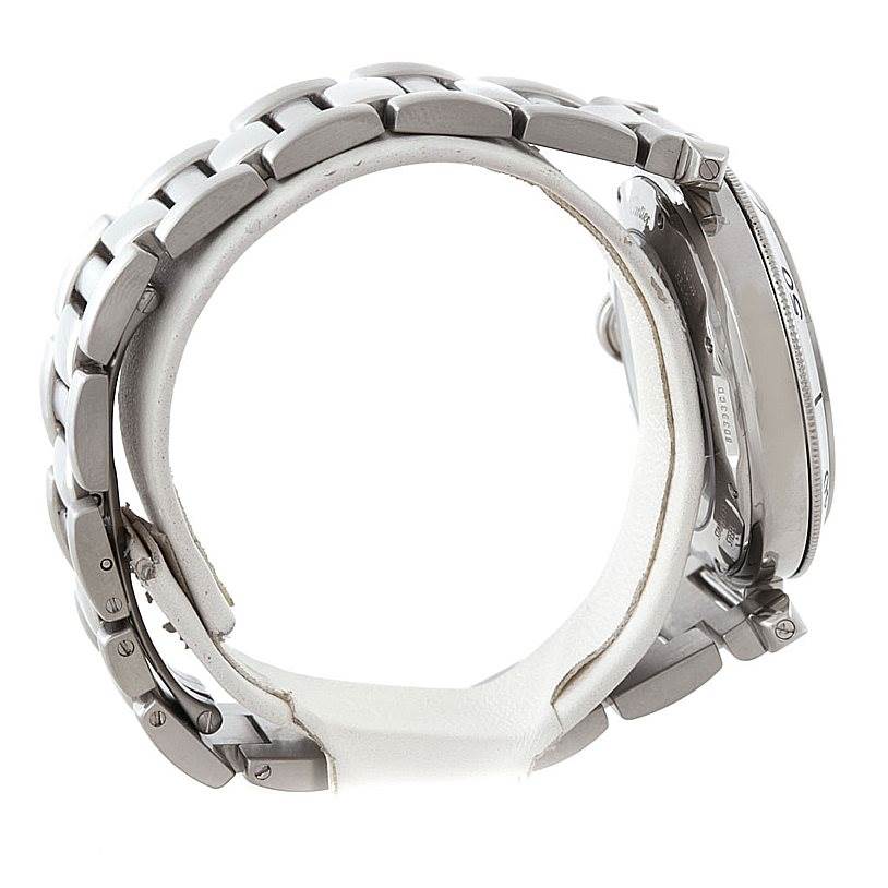 This image shows a Cartier Pasha W31037H3 Men's Stainless Steel Silver Dial W31037H3 Men's Stainless Steel Silver Dial watch from a side angle, highlighting its metal bracelet and the edge of the watch case.