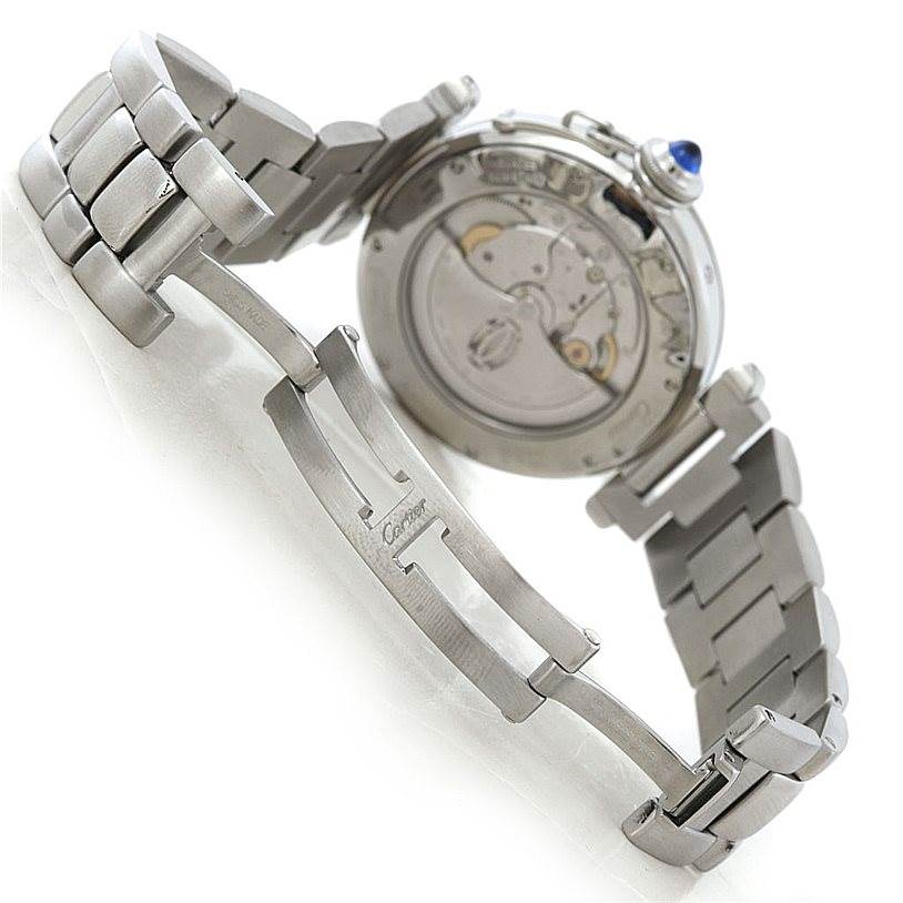 The image shows the underside of a Cartier Pasha W31037H3 Men's Stainless Steel Silver Dial W31037H3 Men's Stainless Steel Silver Dial watch, highlighting its bracelet, clasp, and mechanical movement.