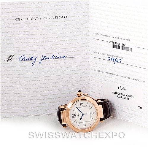 The image shows a Cartier Pasha W3019051 Men
s Rose Gold Silver Dial W3019051 Men
s Rose Gold Silver Dial watch laying flat next to its certificate and paperwork.