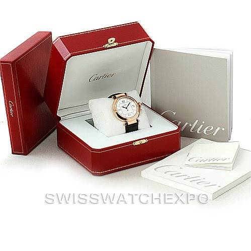 The Cartier Pasha W3019051 Men
s Rose Gold Silver Dial W3019051 Men
s Rose Gold Silver Dial watch is displayed in its open box, with additional manuals and packaging visible in the background.