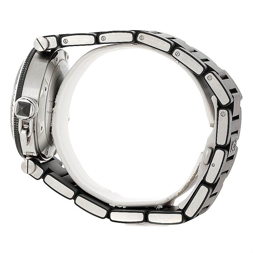 This side view of the Pasha by Cartier watch showcases its case, crown, and metal bracelet links.