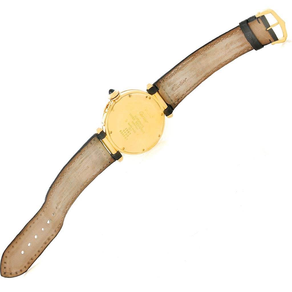 The image shows the back view of a Cartier Pasha Men's Yellow Gold Silver Dial Men's Yellow Gold Silver Dial watch, displaying the case back and leather strap.