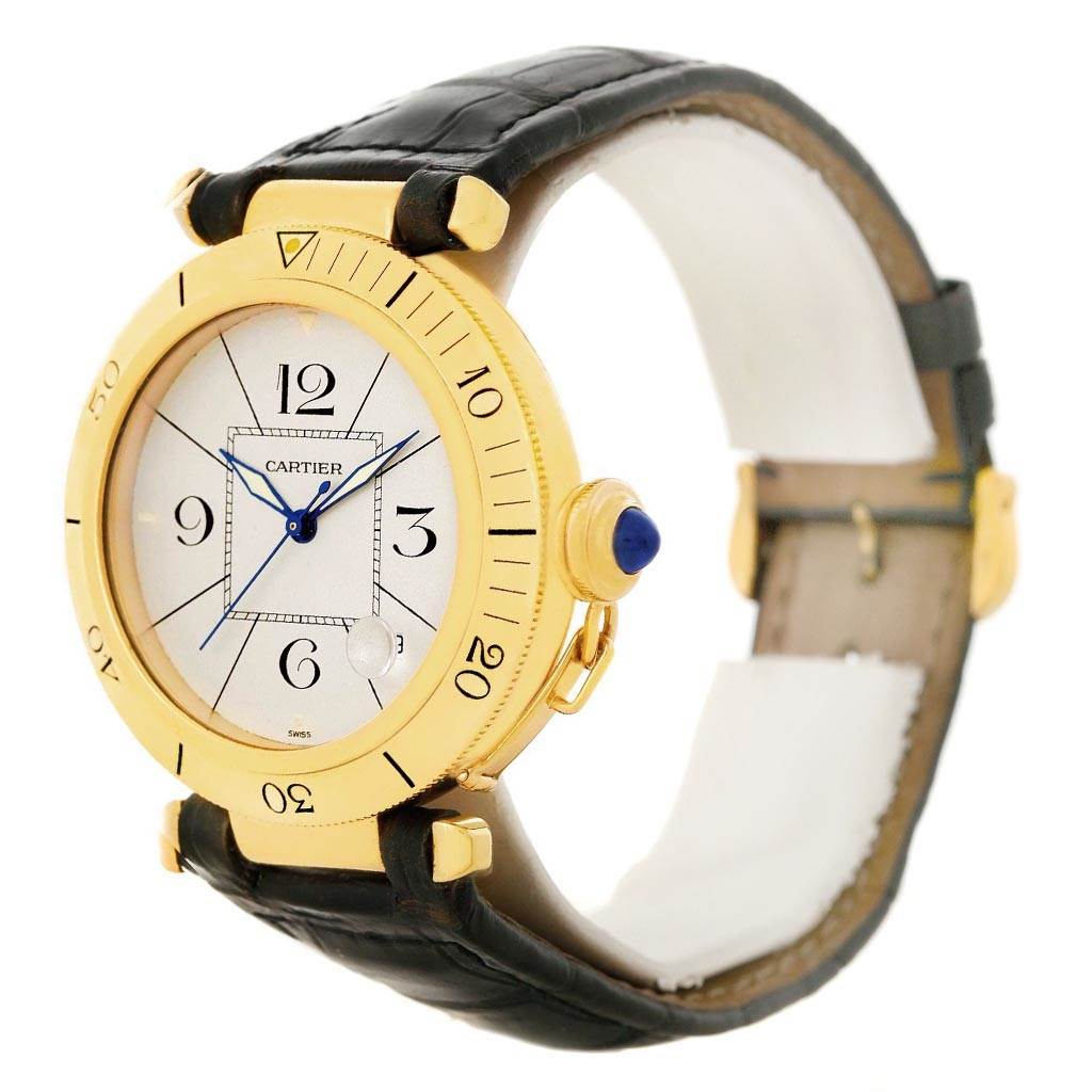 The image shows a side angle of a Cartier Pasha Men's Yellow Gold Silver Dial Men's Yellow Gold Silver Dial watch, highlighting its face, crown, bezel, and leather strap.