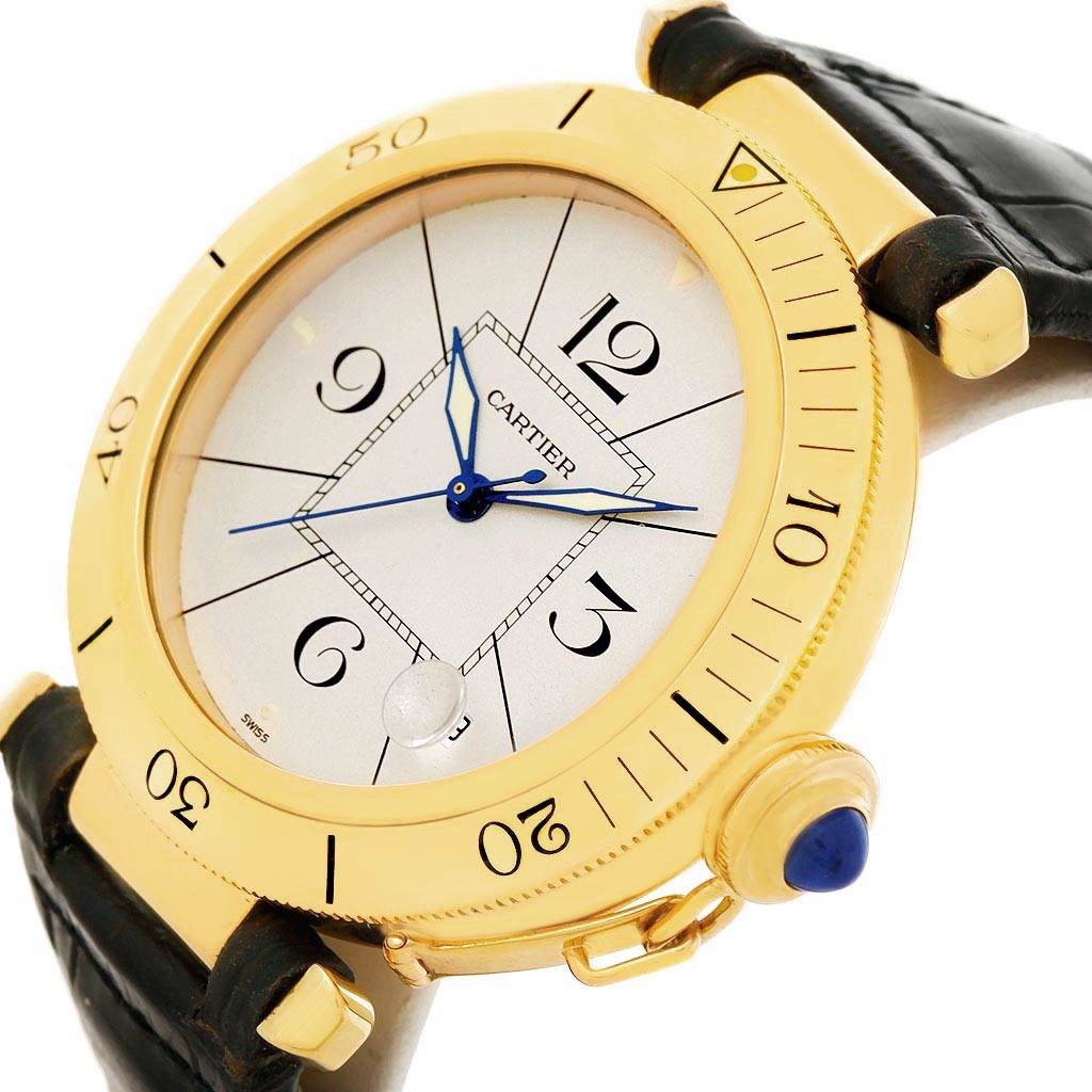 This image shows a close-up, angled view of a Cartier Pasha Men's Yellow Gold Silver Dial Men's Yellow Gold Silver Dial watch, highlighting the dial, bezel, and crown.