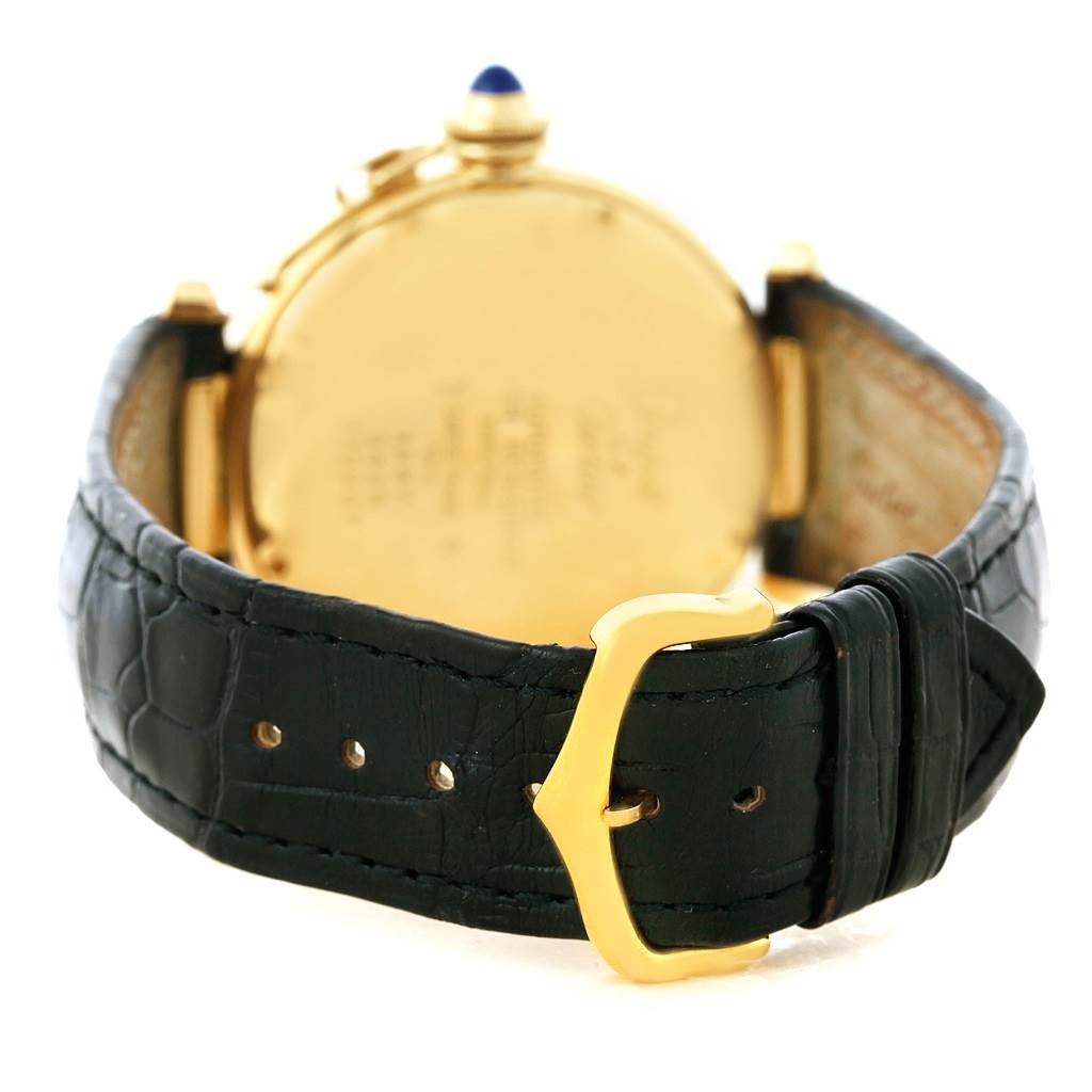 The image shows the back view of a Cartier Pasha Men's Yellow Gold Silver Dial Men's Yellow Gold Silver Dial watch, highlighting its gold case, black leather strap, and gold buckle.