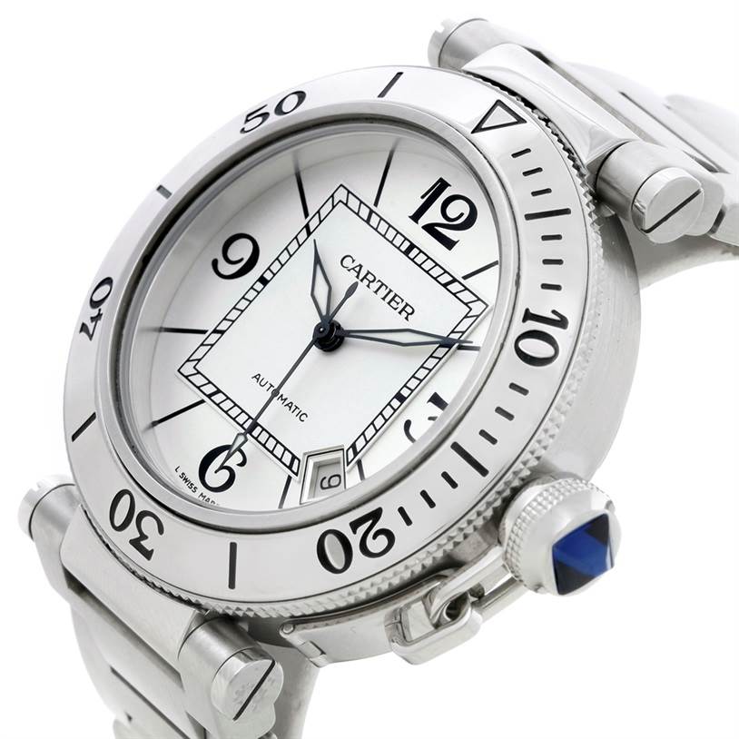 This image shows a close-up angle of the Cartier Pasha W31080M7 Men
s Stainless Steel Silver Dial W31080M7 Men
s Stainless Steel Silver Dial watch, highlighting the face, bezel, and crown with a blue gemstone.