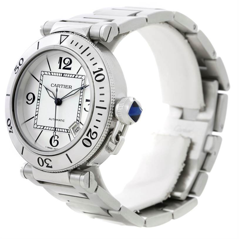 The image shows a side angle of the Cartier Pasha W31080M7 Men
s Stainless Steel Silver Dial W31080M7 Men
s Stainless Steel Silver Dial watch, highlighting the bezel, crown with a blue cabochon, and metal bracelet.