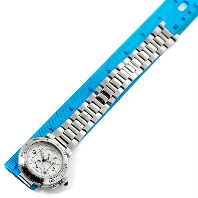 The Cartier Pasha W31037H3 Men
s Stainless Steel Silver Dial W31037H3 Men
s Stainless Steel Silver Dial watch is shown at an angle with the face, bracelet, and a ruler for scale.