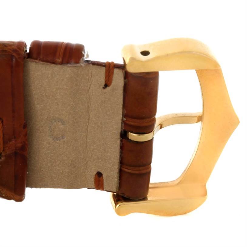 This image shows a close-up side view of the leather strap and gold buckle of the Cartier Pasha 10351 Men's Yellow Gold Silver Dial 10351 Men's Yellow Gold Silver Dial model watch.