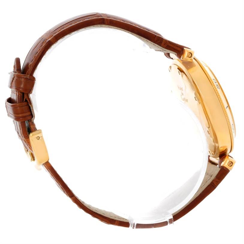 This image shows a side view of the Cartier Pasha 10351 Men's Yellow Gold Silver Dial 10351 Men's Yellow Gold Silver Dial watch, highlighting the brown leather strap and gold case.