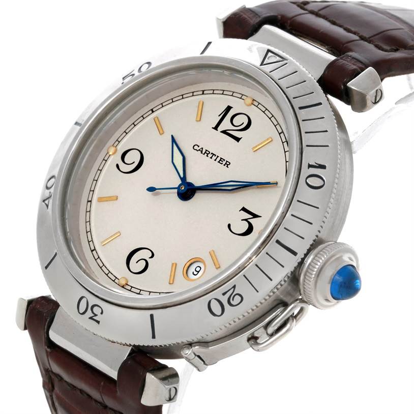 The image shows a Cartier Pasha Stainless Steel Silver Dial Stainless Steel Silver Dial watch at a slight angle, displaying its face, crown, bezel, and part of the strap.