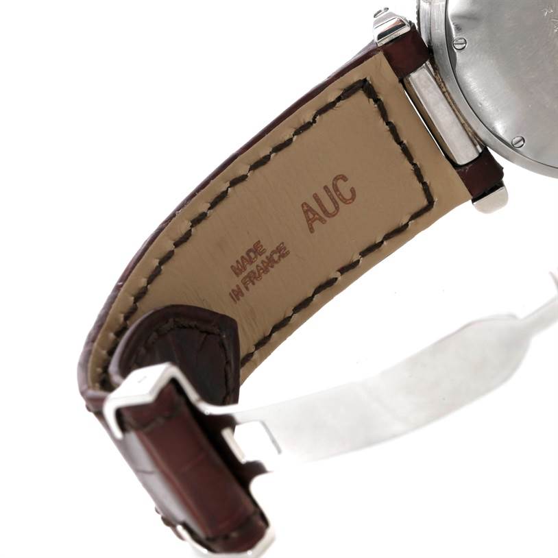 This image shows the underside of the leather strap and part of the case back of a Cartier Pasha Stainless Steel Silver Dial Stainless Steel Silver Dial watch, revealing "Made in France" and "AUC."