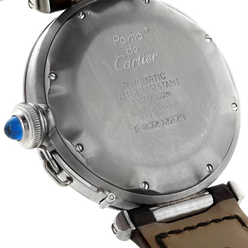 The image shows the back case and part of the strap of a Cartier Pasha Stainless Steel Silver Dial Stainless Steel Silver Dial watch, displaying its engravings and crown.