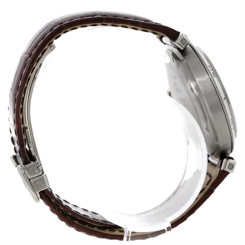 This side view of a Cartier Pasha Stainless Steel Silver Dial Stainless Steel Silver Dial watch shows the brown leather strap and exposed case back.