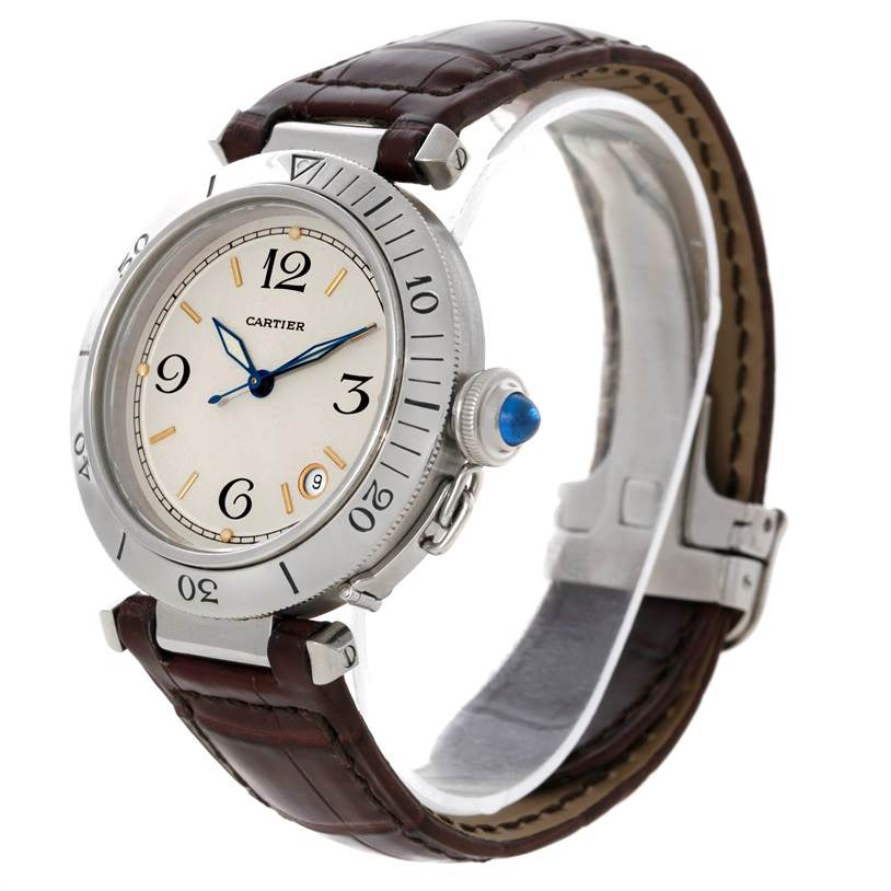 The Cartier Pasha Stainless Steel Silver Dial Stainless Steel Silver Dial watch is shown at a three-quarter angle, displaying its dial, bezel, crown, and leather strap.