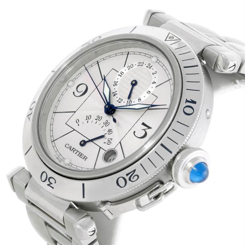 The Cartier Pasha W31037H3 Men
s Stainless Steel Silver Dial W31037H3 Men
s Stainless Steel Silver Dial watch is shown at an angle highlighting the face, bezel, and crown with a blue cabochon.