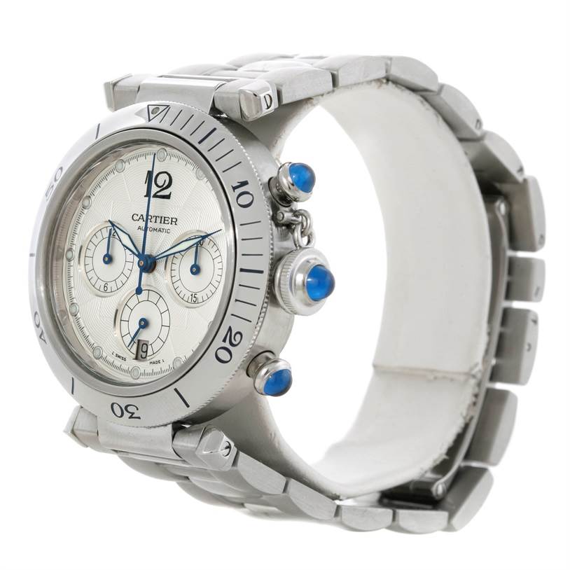 The image shows a side angle of the Cartier Pasha W31030H3 Men's Stainless Steel Silver Dial W31030H3 Men's Stainless Steel Silver Dial watch, displaying the dial, bezel, and bracelet with blue cabochon crown and pushers.