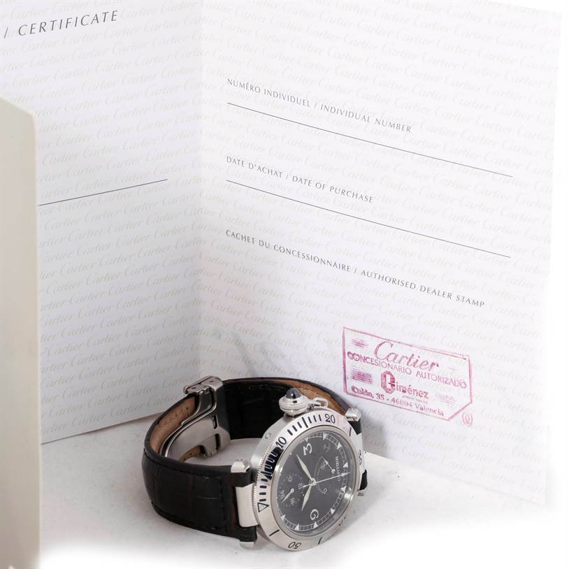 The image shows a Cartier Pasha W3105155PR Men's Stainless Steel Grey Dial W3105155PR Men's Stainless Steel Grey Dial watch at an angle, displayed with its certificate booklet in the background.