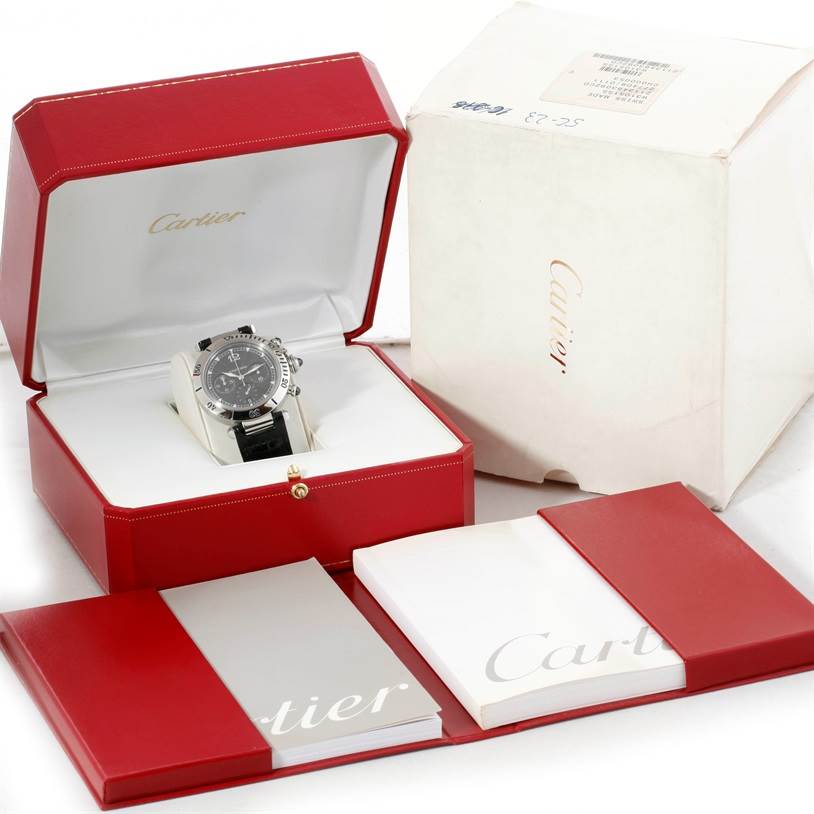 The Cartier Pasha W3105155 Men's Stainless Steel Grey Dial W3105155 Men's Stainless Steel Grey Dial watch is shown in its open red box, along with its white outer box and accompanying booklets.