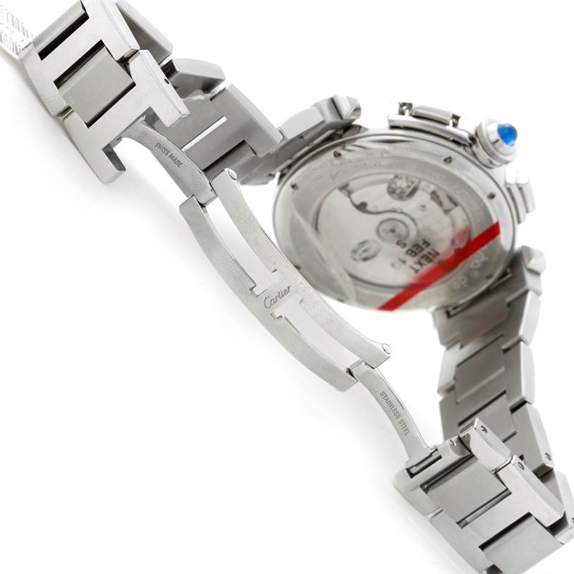 The image shows the open clasp and partially visible case back of a Pasha model watch by Cartier.