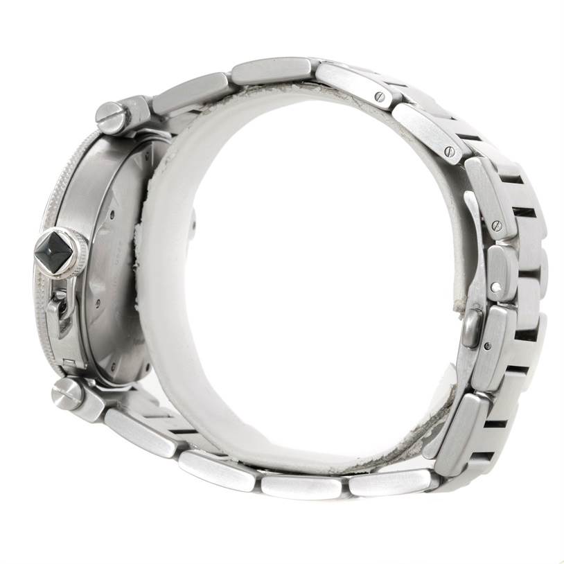 The image shows a Cartier Pasha W31077M7 Men's Stainless Steel Black Dial W31077M7 Men's Stainless Steel Black Dial watch from a side angle, highlighting its crown, lugs, and metal bracelet.