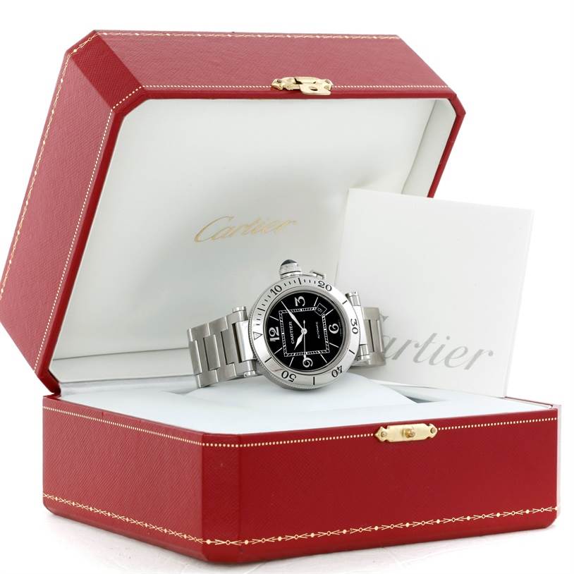 The Cartier Pasha W31077M7 Men's Stainless Steel Black Dial W31077M7 Men's Stainless Steel Black Dial watch is shown in an open red box, displaying the face, bezel, and bracelet.