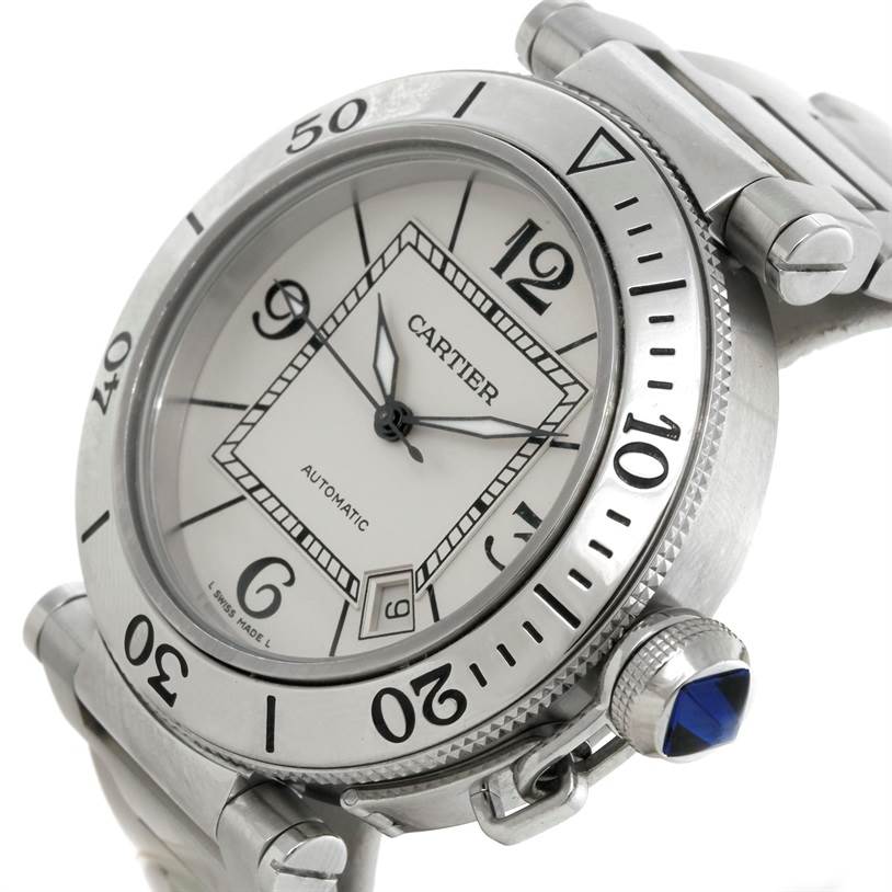 The image shows a close-up angled view of the Cartier Pasha W31080M7 Men
s Stainless Steel Silver Dial W31080M7 Men
s Stainless Steel Silver Dial watch, featuring its dial, bezel, and crown with a blue gem.