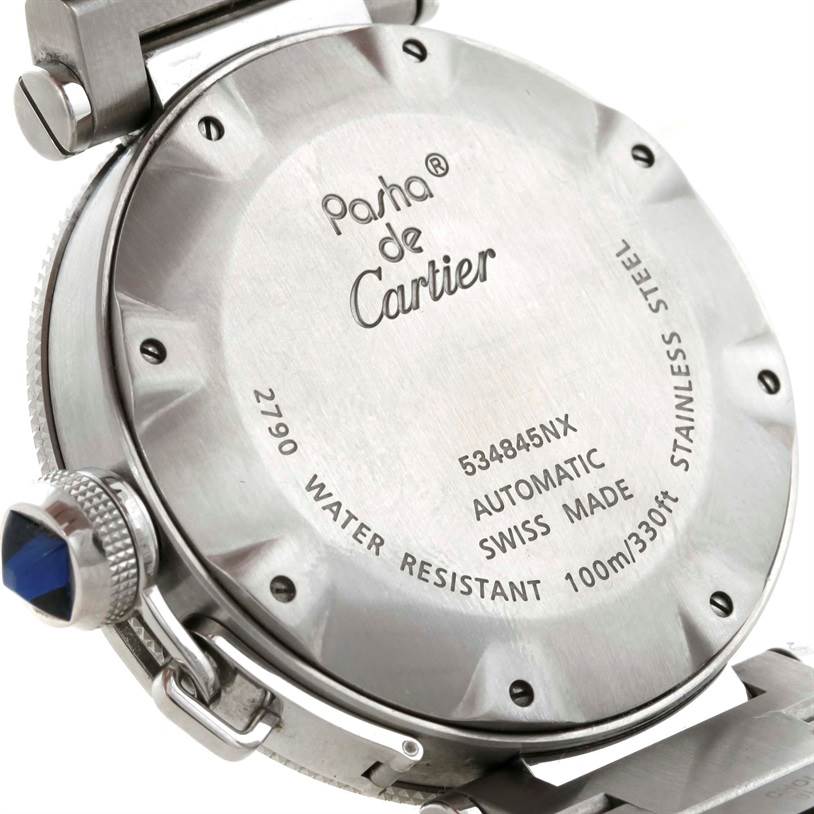 The image shows the back case of a Pasha de Cartier watch, highlighting the model and brand details engraved on it.