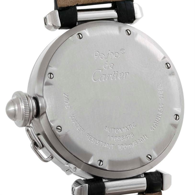 The image shows the back and side of a Cartier Pasha W31055M7 Men's Stainless Steel Silver Dial W31055M7 Men's Stainless Steel Silver Dial watch with visible engraving and leather straps.